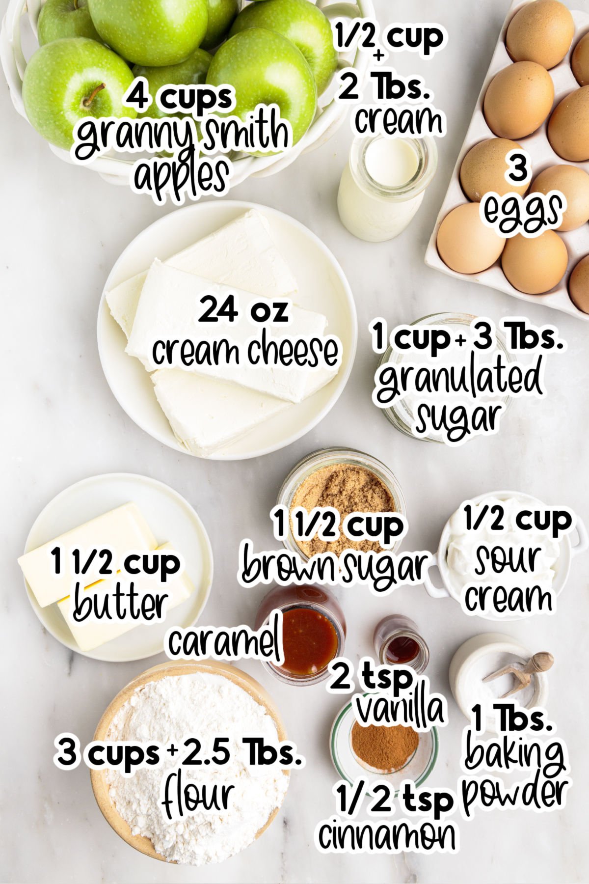 Individual ingredients for the apple cheesecake bars set in bowls and dishes, with text labels.