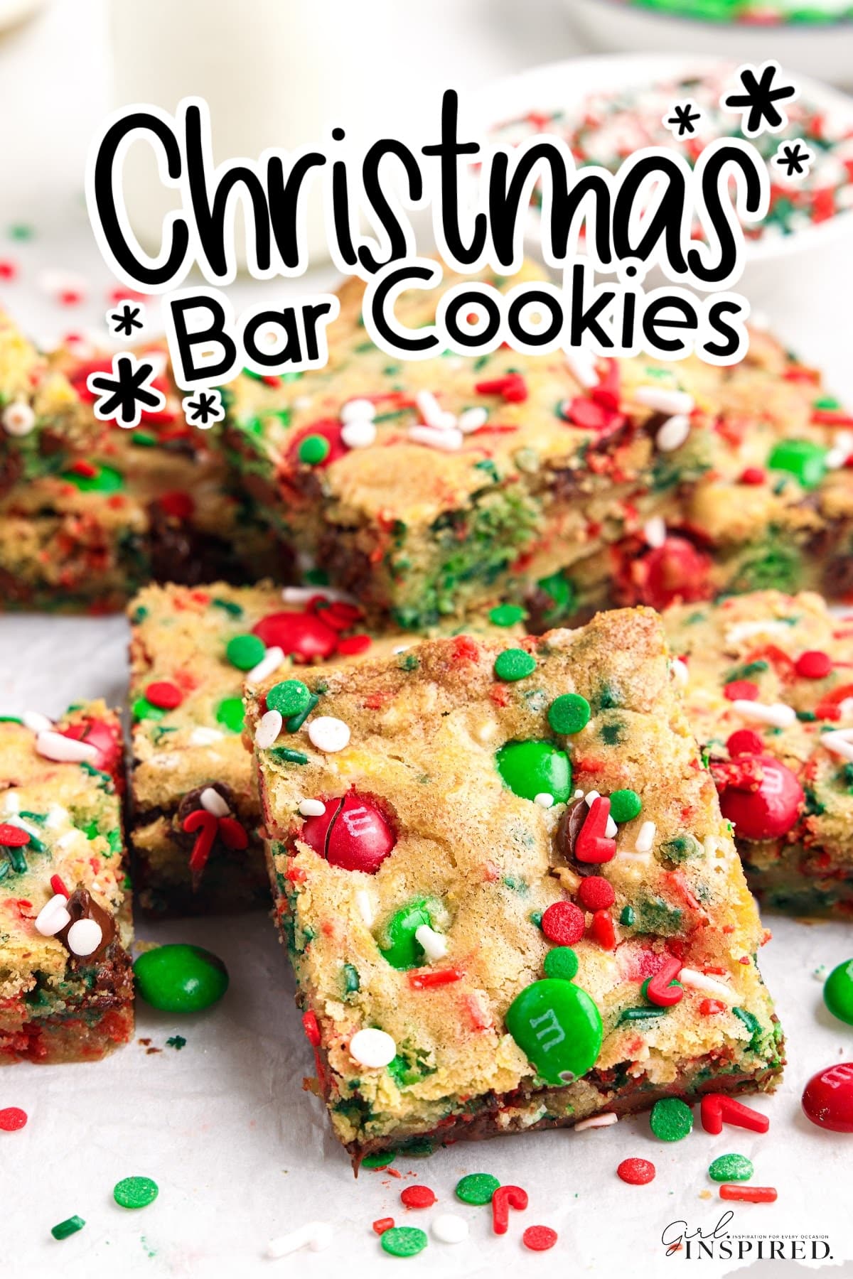 Christmas cookie bar squares set out on parchment paper with text "Christmas bar cookies."