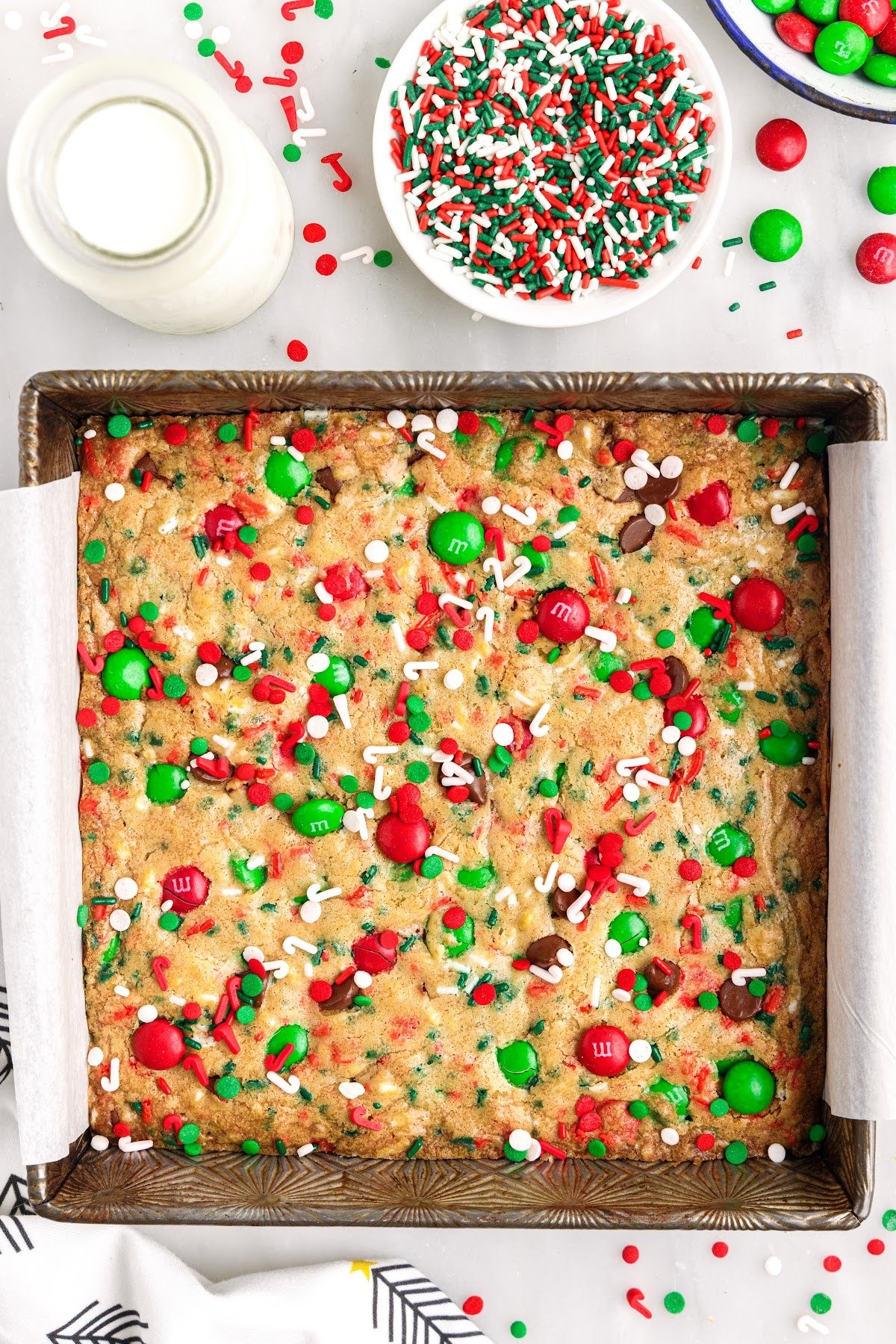 Baked Christmas bar cookies with holiday sprinkles on top.