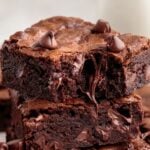 Two chewy homemade brownies stacked on top of each other.