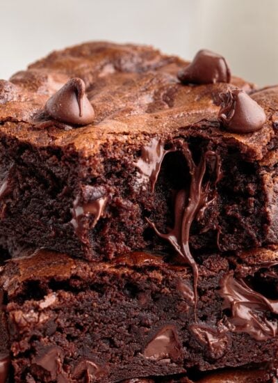 Two chewy homemade brownies stacked on top of each other.