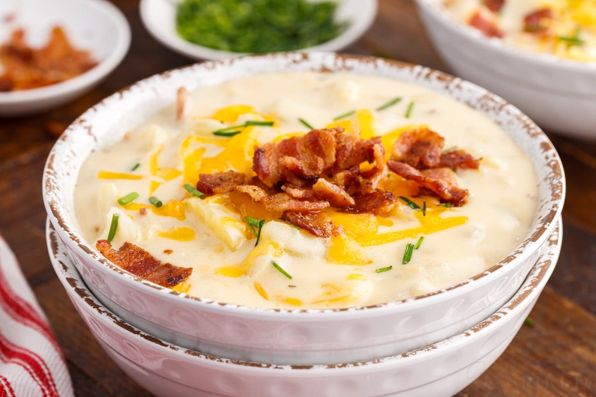 close up of a bowl of bacon cheddar potato soup