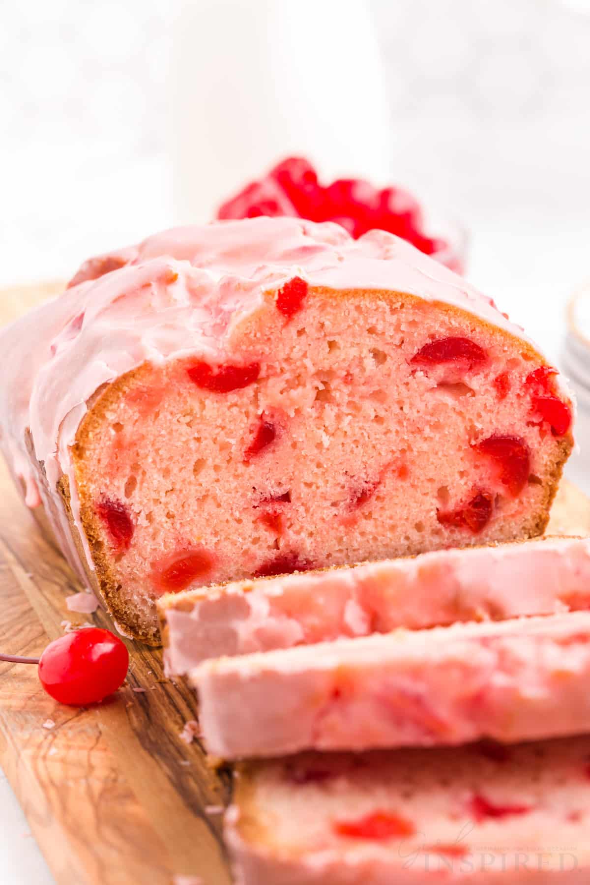 front view of cherry bread after three slices being sliced