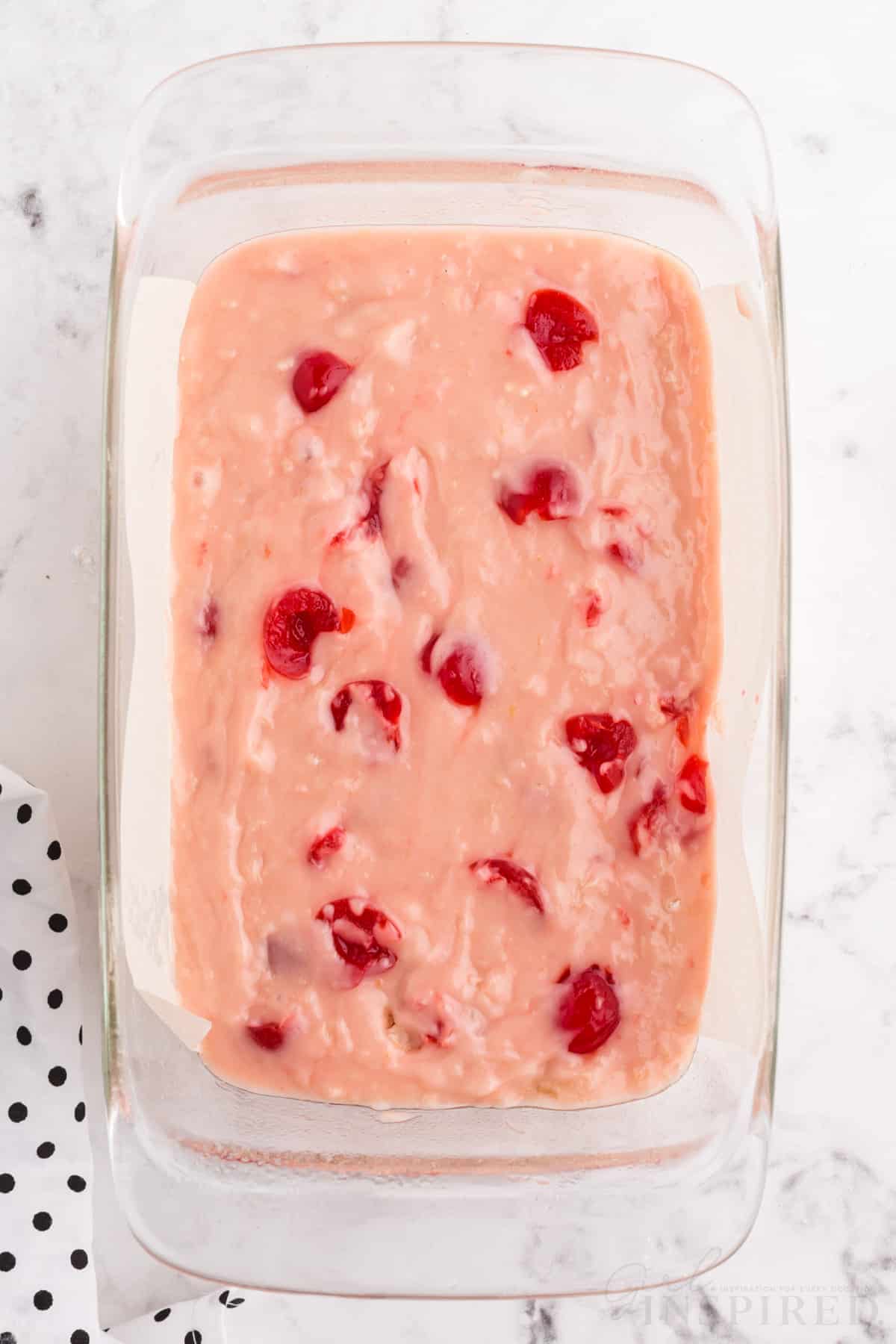 cherry bread batter in a 9x5 loaf pan