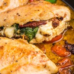 Close-up of chicken with sundried tomatoes and spinach.