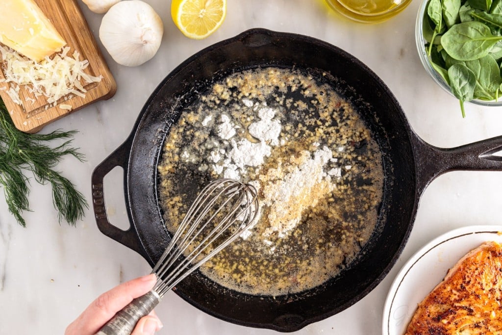 flour whisked into garlic butter mixture in skillet