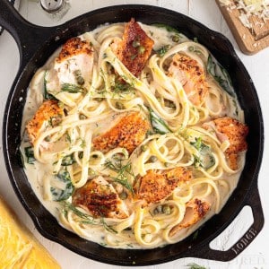 cooked creamy salmon pasta in cast iron skillet