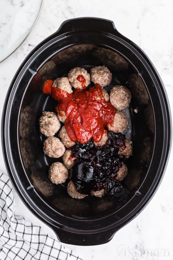 Meatballs, chili sauce, and grape jelly in crockpot