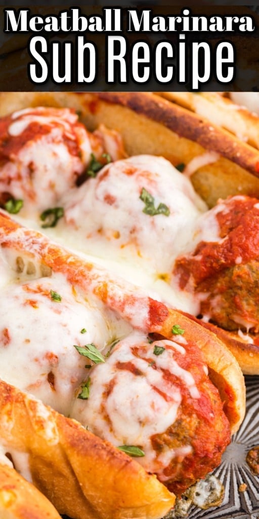 Close up of Meatball Subs topped with melted cheese.