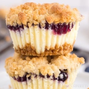 Mini Blueberry Cheesecakes stacked.