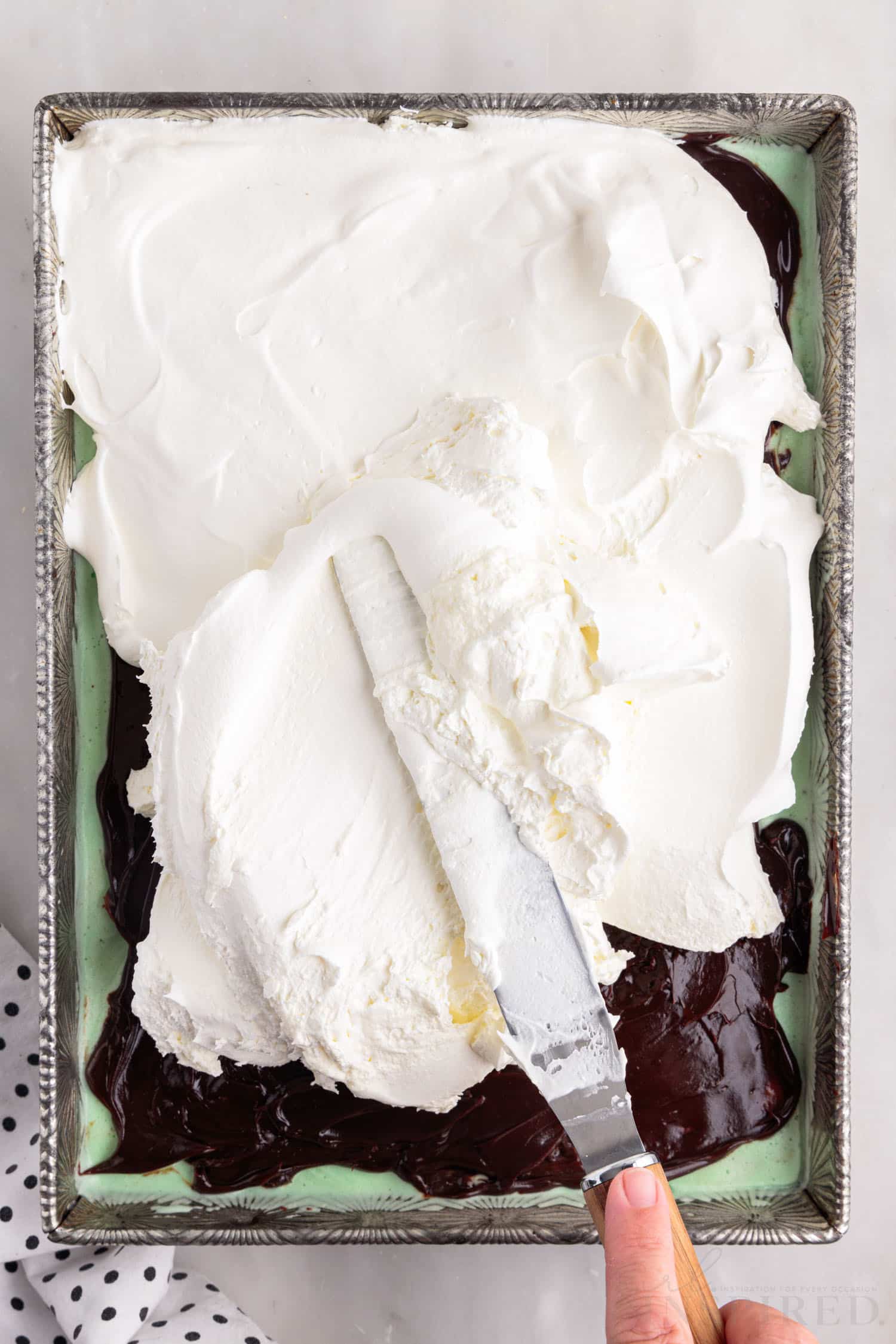 cool whip spread onto hot fudge layer
