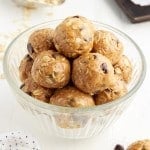 front close up of a small glass dish of no bake peanut butter oat balls.