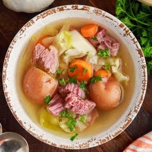 Top view of corned beef and cabbage soup in a bowl.