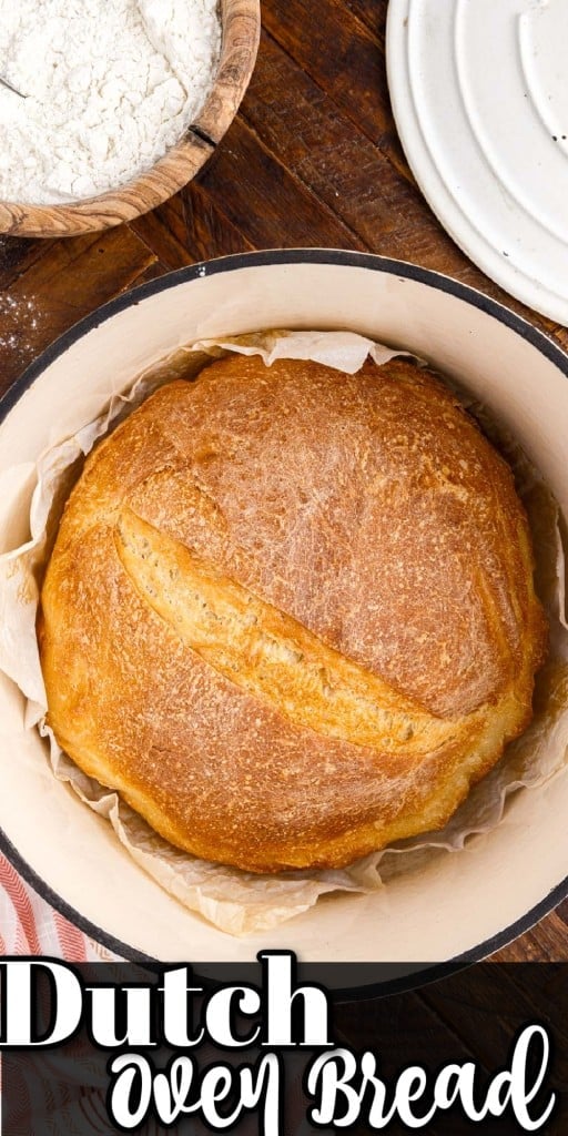 top view of a dutch oven with a baked loaf of dutch oven bread in it