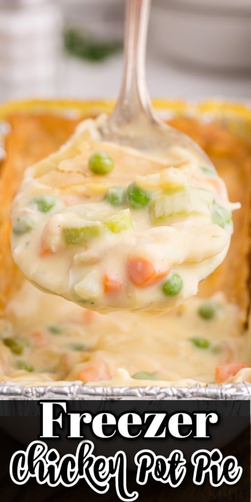 Close-up of Freezer Chicken Pot Pie with a helping of pie on a serving spoon held above the pie.