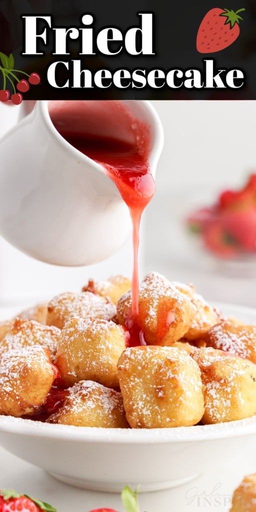 Strawberry sauce being drizzled on top of fried cheesecakes.
