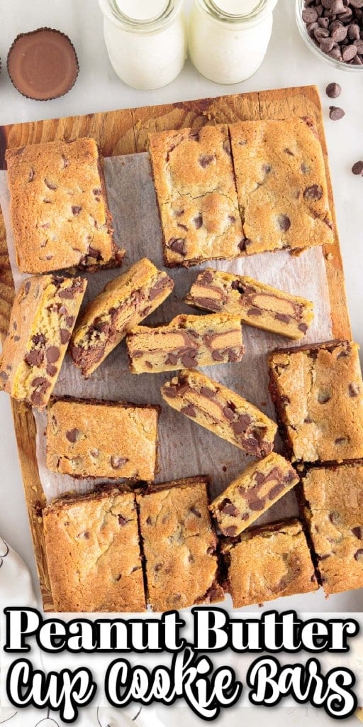 Top close view of peanut butter cup cookie bars on cutting board with two milk bottles
