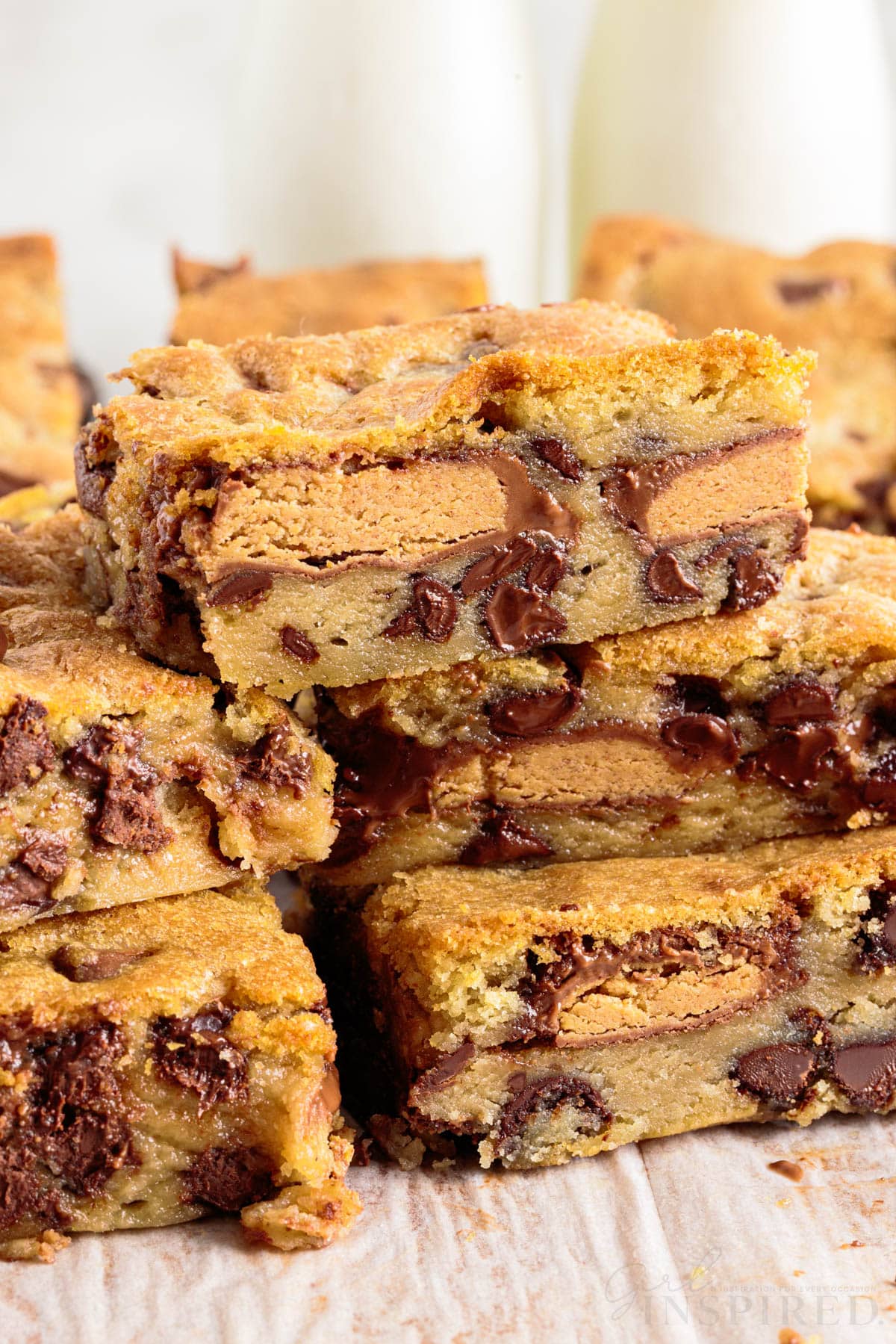 Front close up of stacked peanut butter cup cookie bars.
