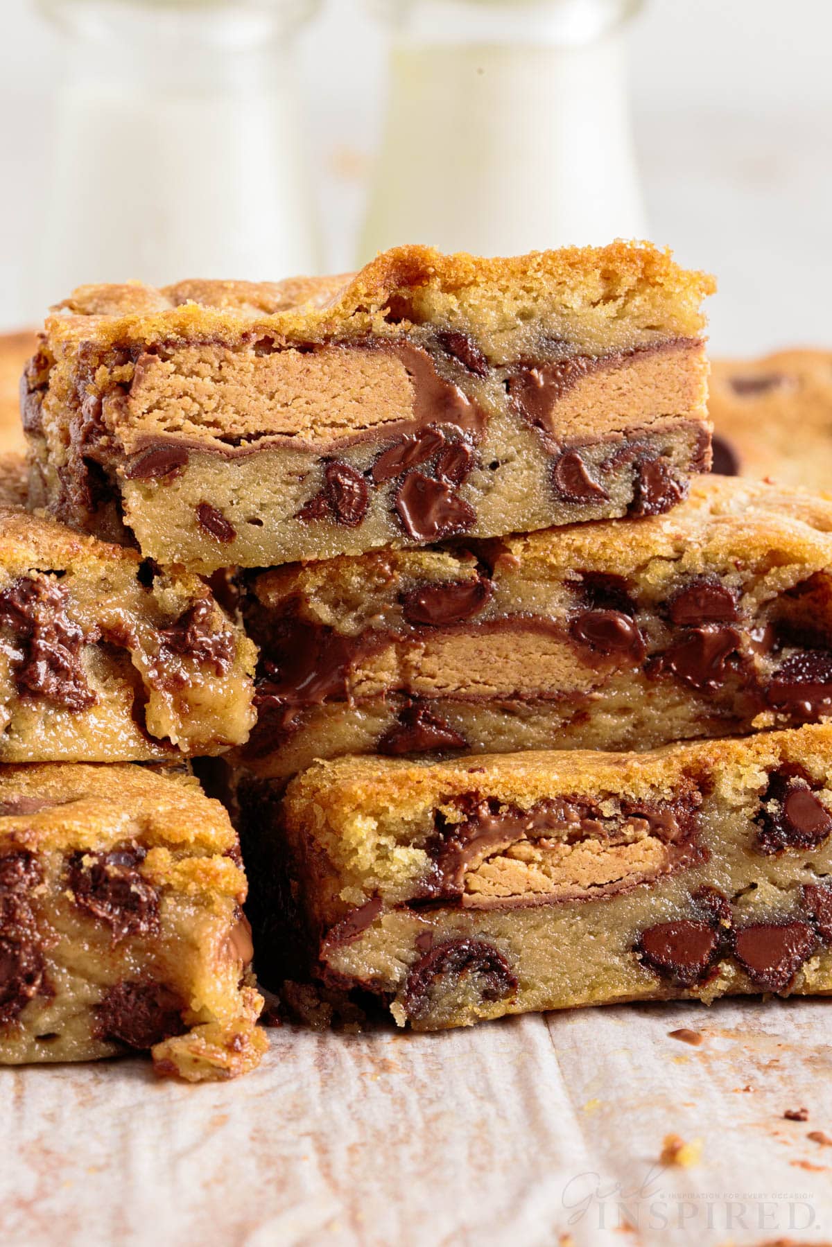 Peanut butter cup cookie bars stacked on each other.