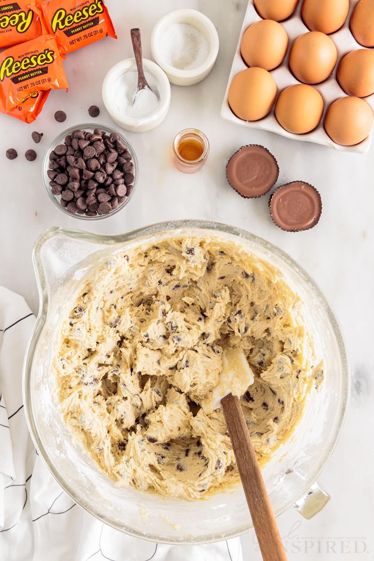 Dough mixed together with spatula for peanut butter cup cookie bars.