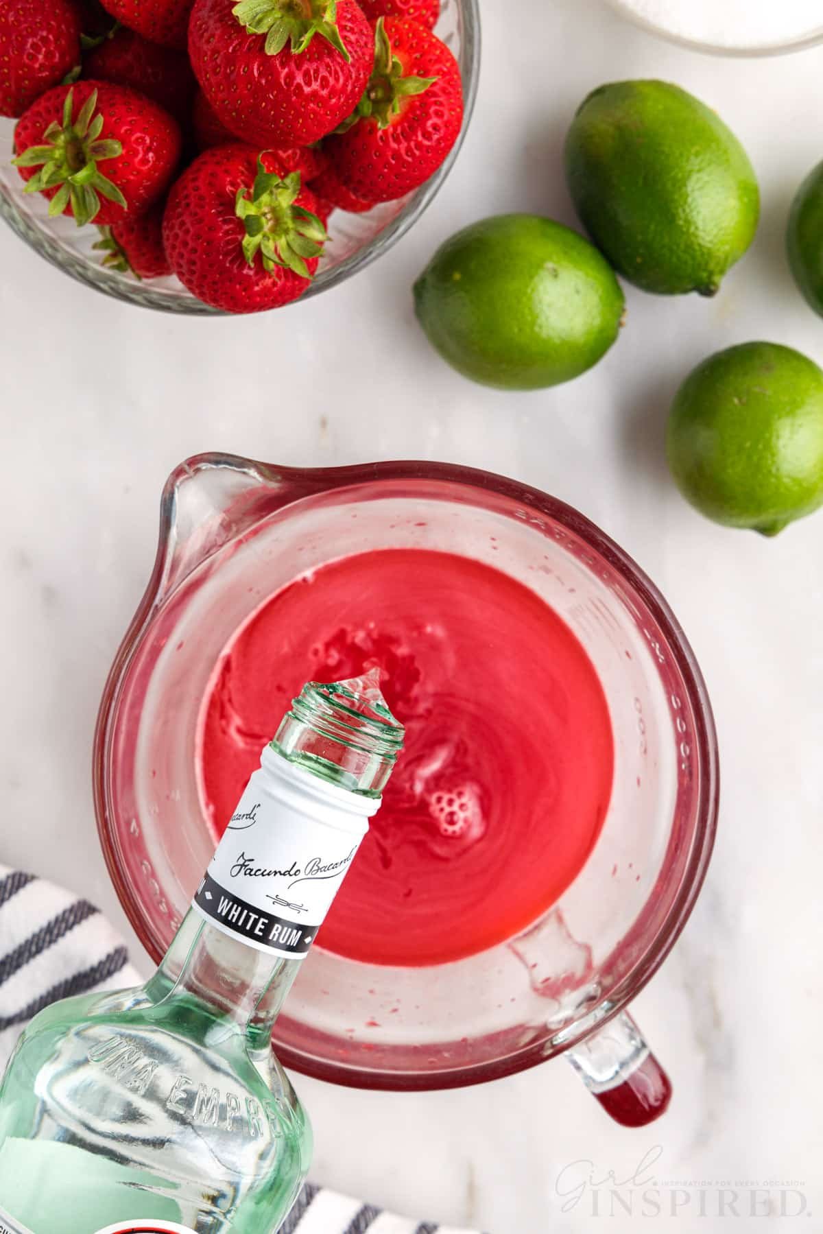 Pouring rum into gelatin mixture.