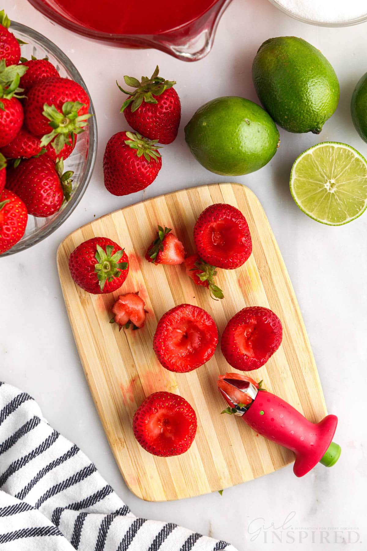 Strawberries hollowed out with strawberry corer kitchen tool.