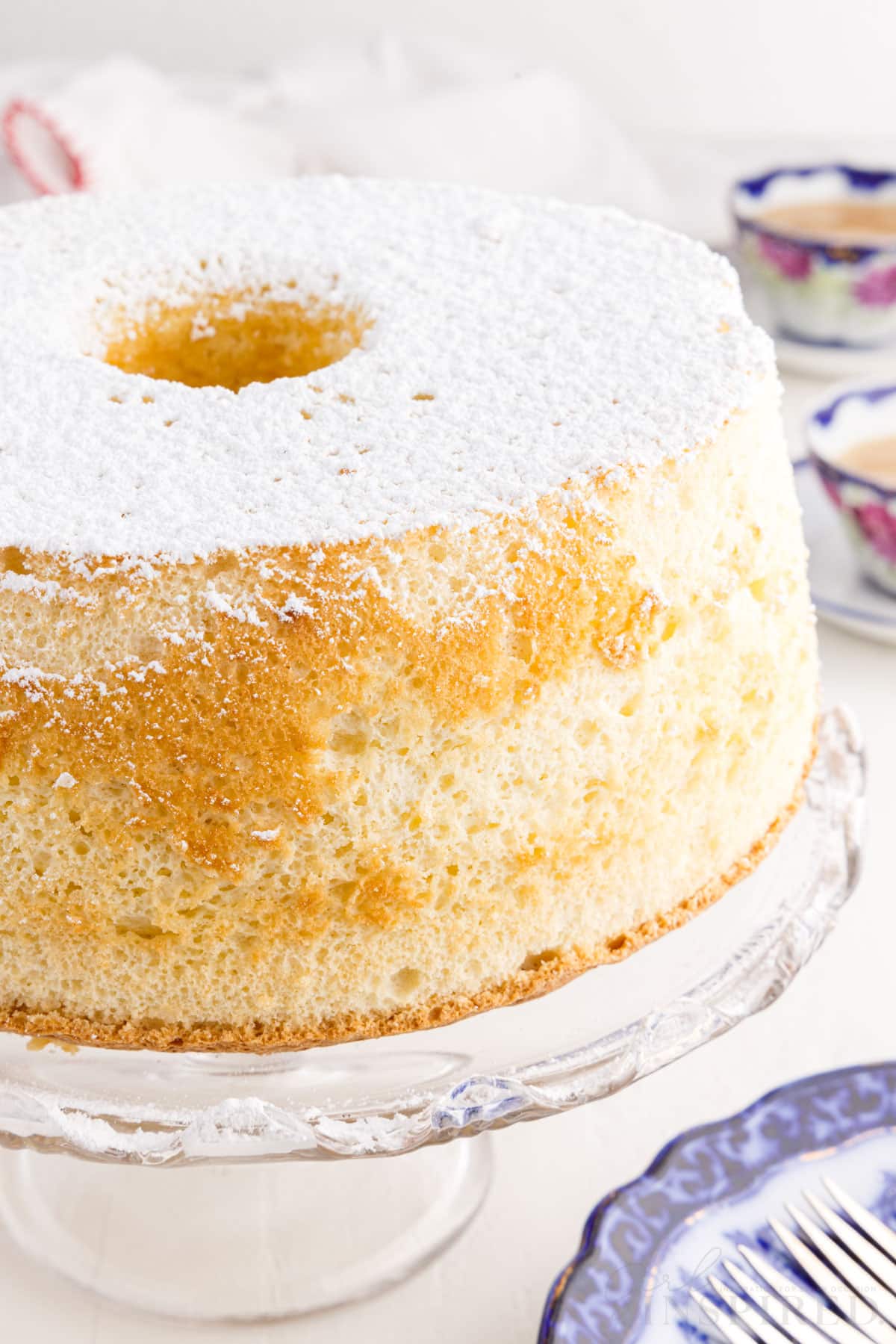 Front view of Vanilla Chiffon Cake on a cake stand.