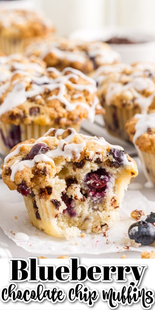 Blueberry chocolate chip muffins on a tray with sugar glaze drizzled over the top.