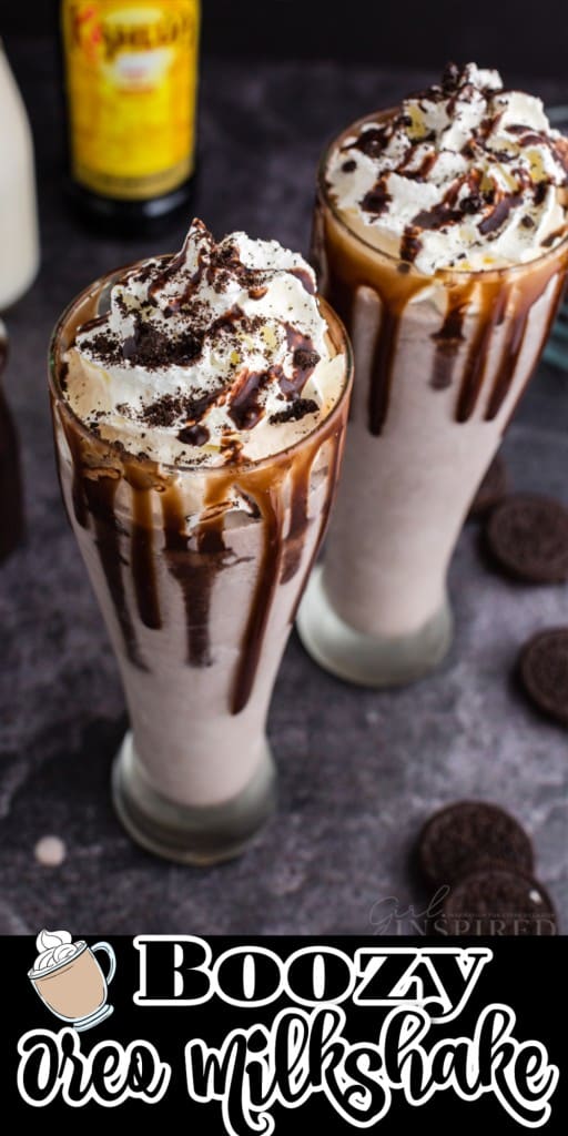 Two glasses of Boozy Oreo Milkshake, a bottle of kahlua, milk and coffee with Oreo cookies on countertop.