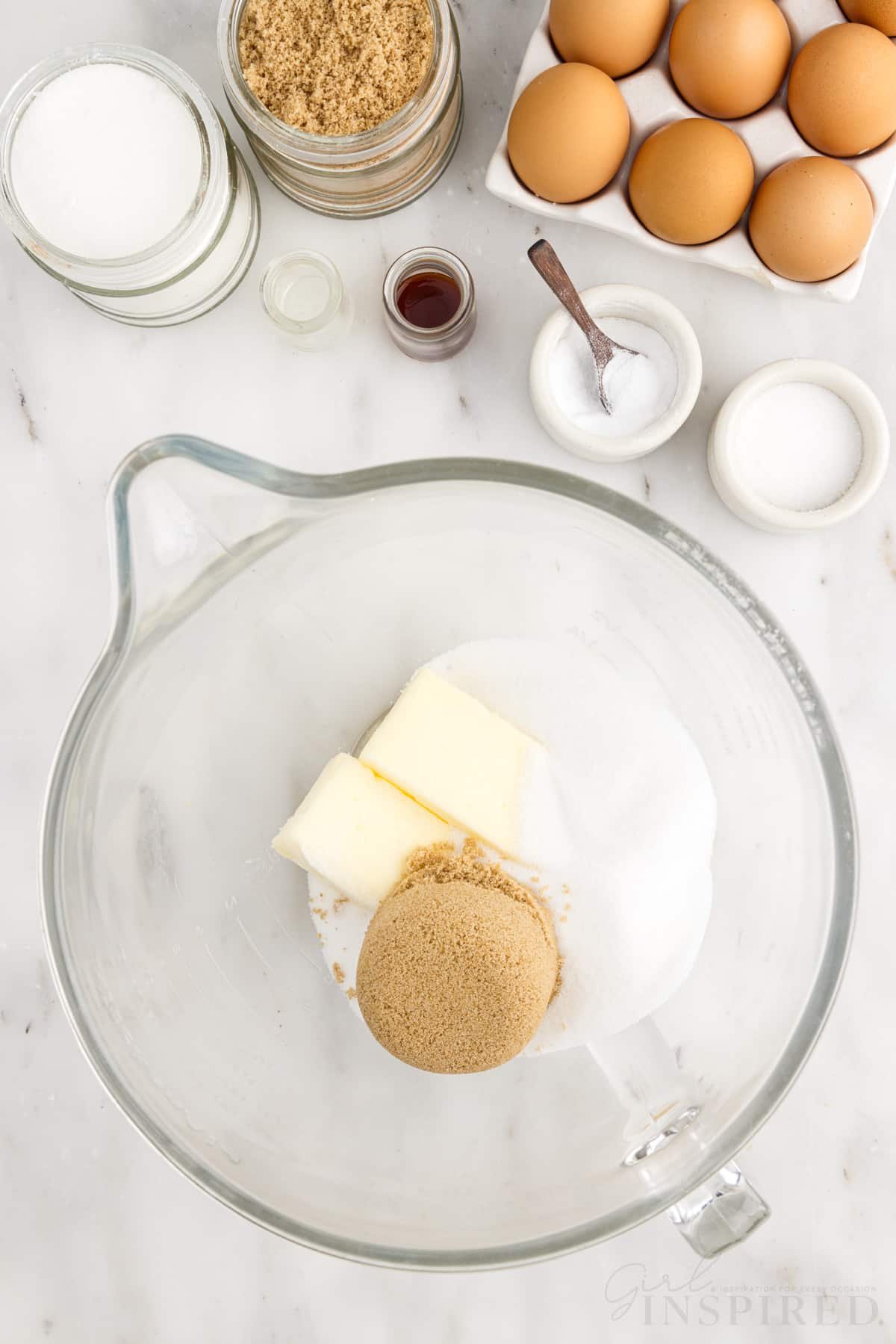 Mixing bowl with sugar, brown sugar, and butter.