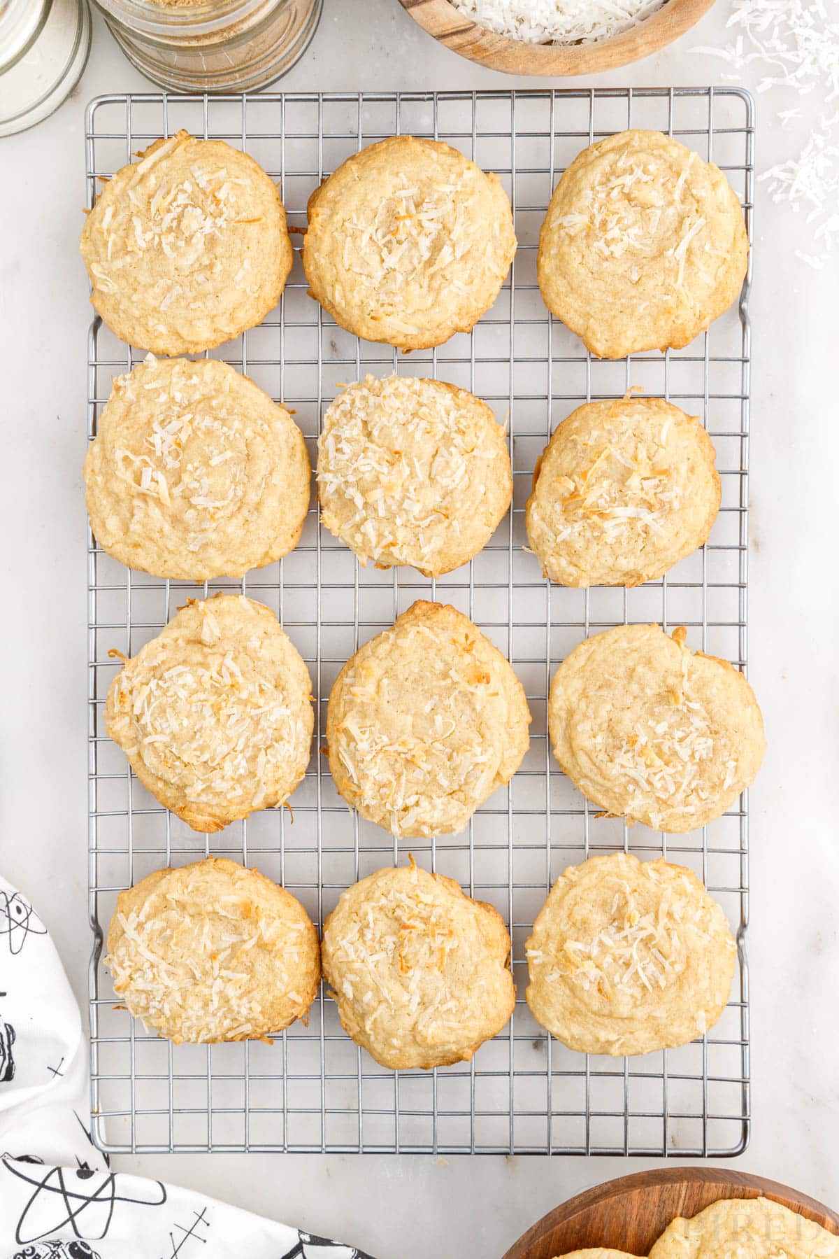 Chewy Coconut Cookies on a cooling rack.