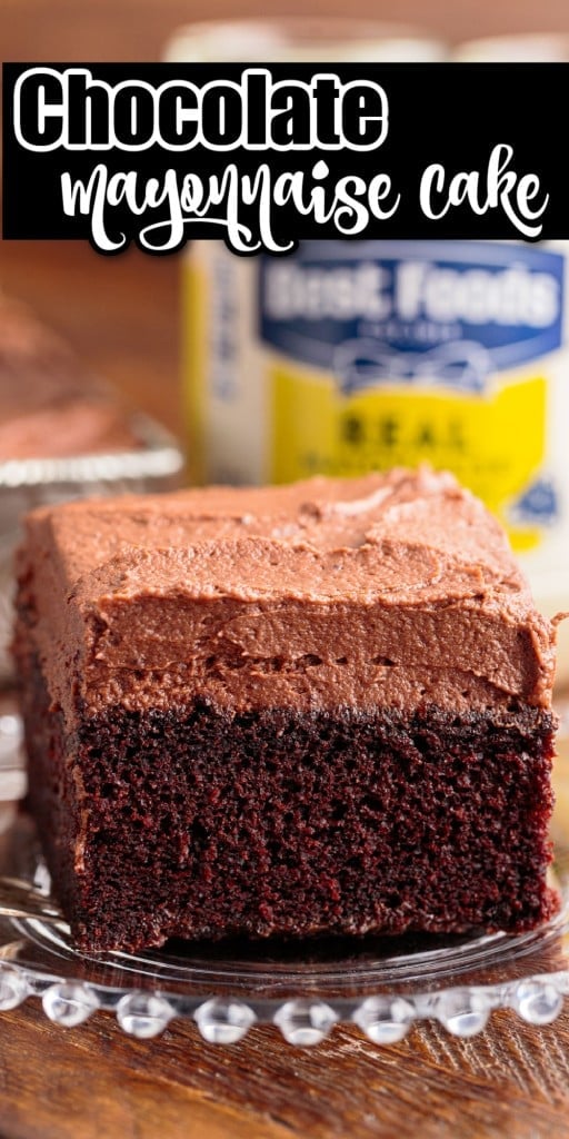 Front view of a slice of Chocolate Mayonnaise Cake on a plate with mayonnaise bottle in the background.