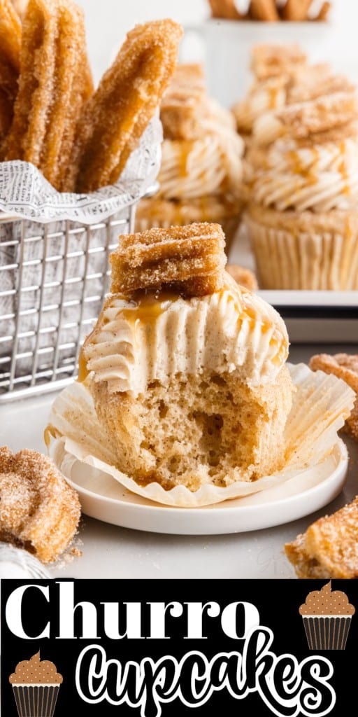 A Churro Cupcake with a bite missing, on a dish, in front of Churros and Churro Cupcakes on a platter.