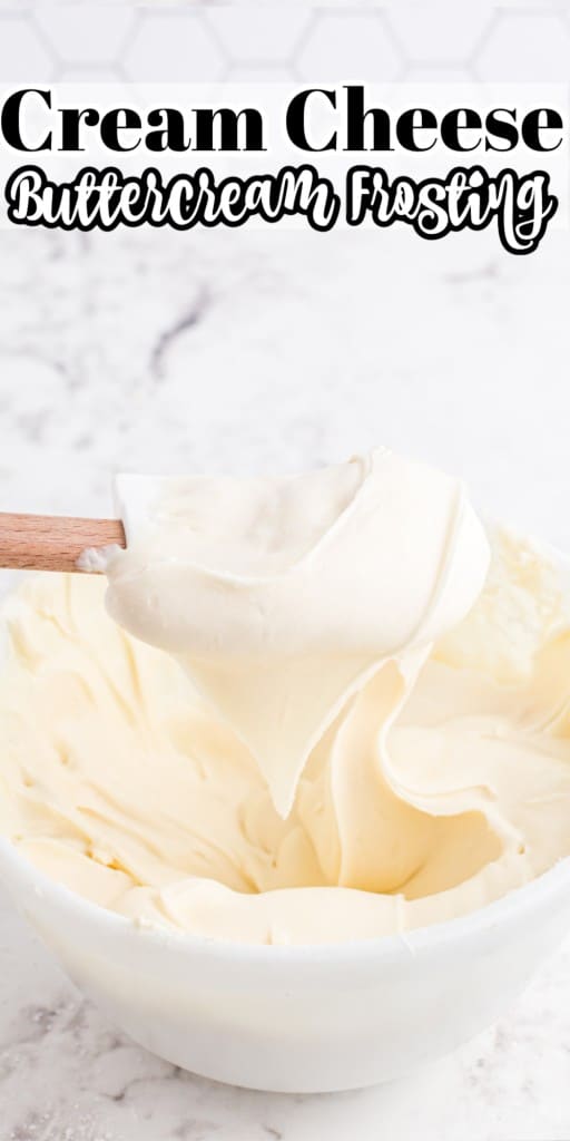 Plastic spatula held above a mixing bowl with cream cheese buttercream frosting.