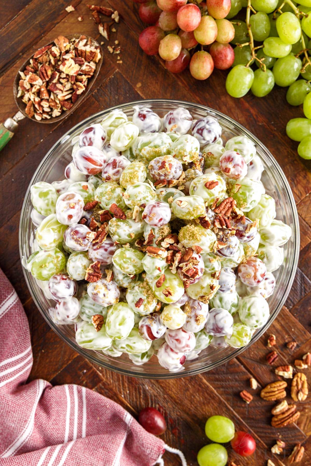 Overhead of creamy grape salad in serving bowl.