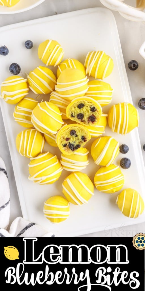 Overhead of platter with lemon blueberry bites and a cut open bite on top.