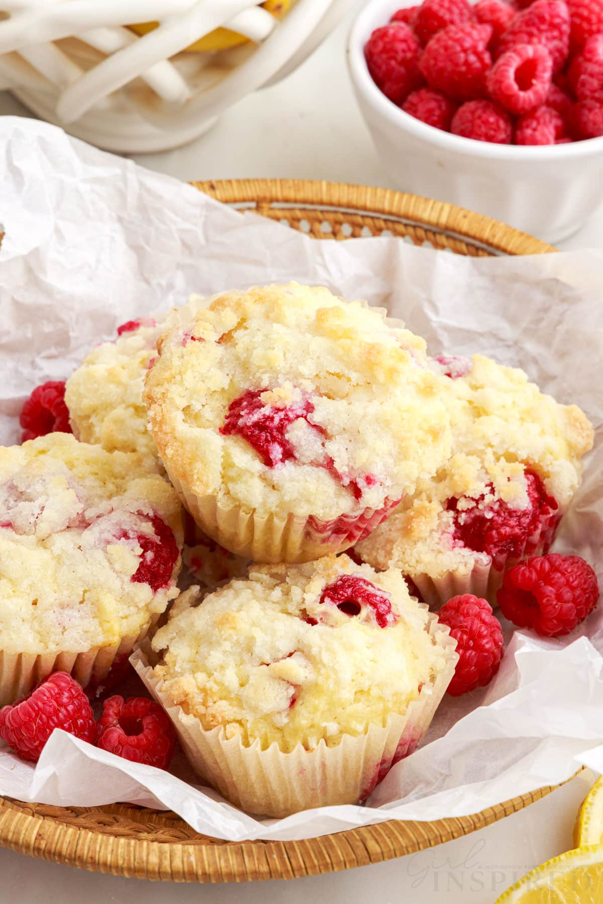 A lined basket of Lemon Raspberry Muffins.