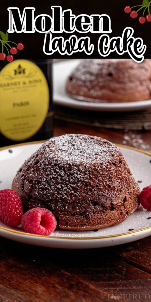 Front view of a Molten Lava Cake on a small dish with raspberries.