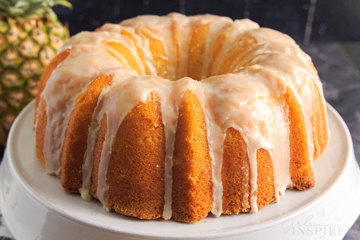 Front view of Pineapple Pound Cake on a cake stand.