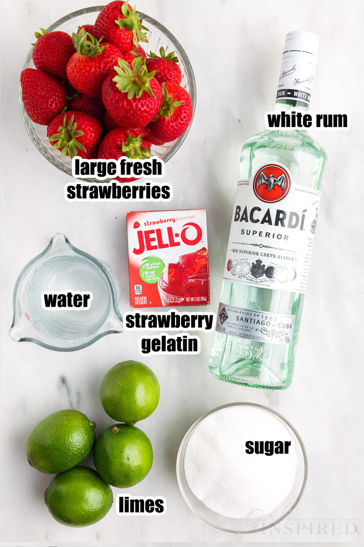 Ingredients for strawberry daiquiri jello shots set out.