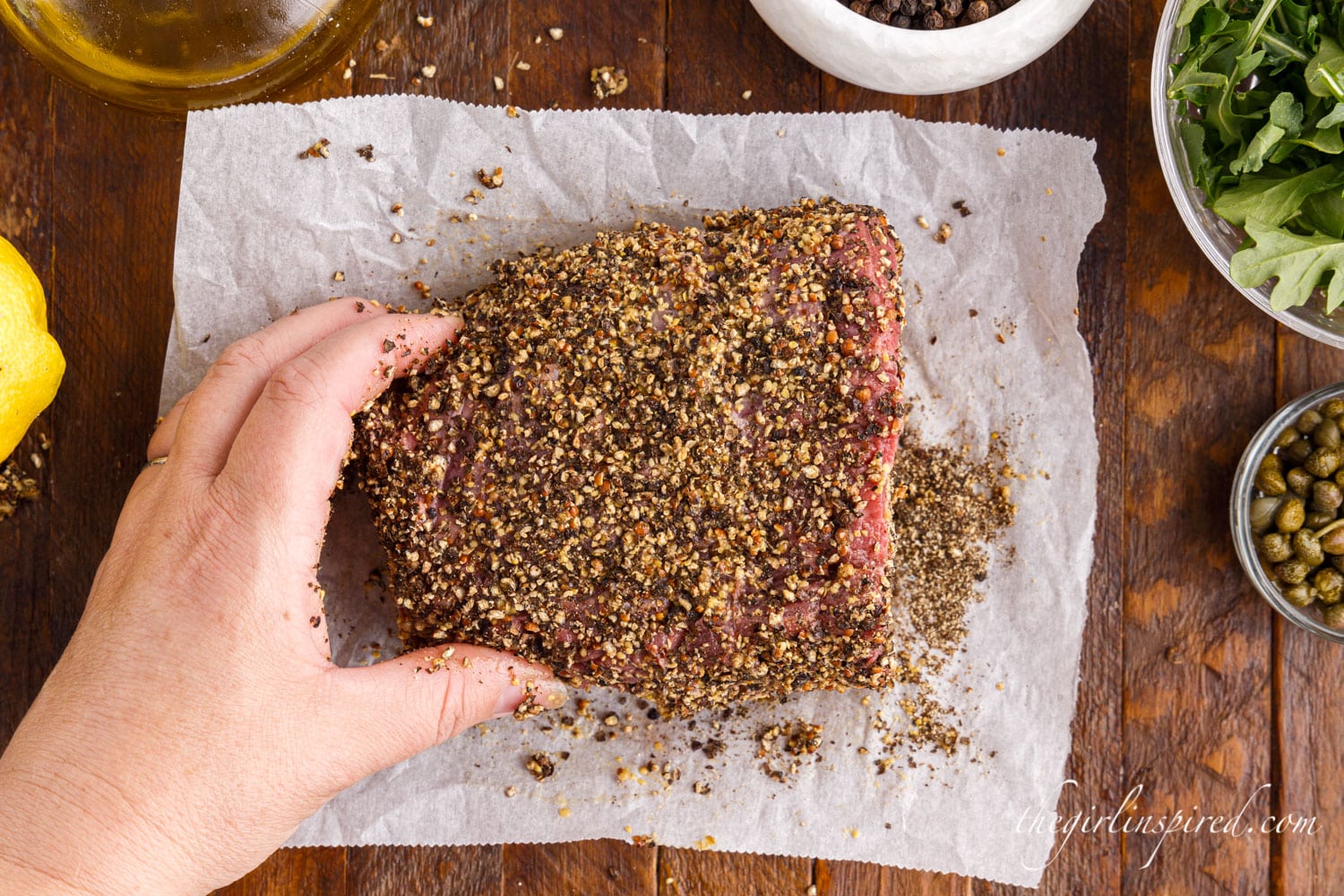 Tenderloin turned over to coat the other side with peppercorns.