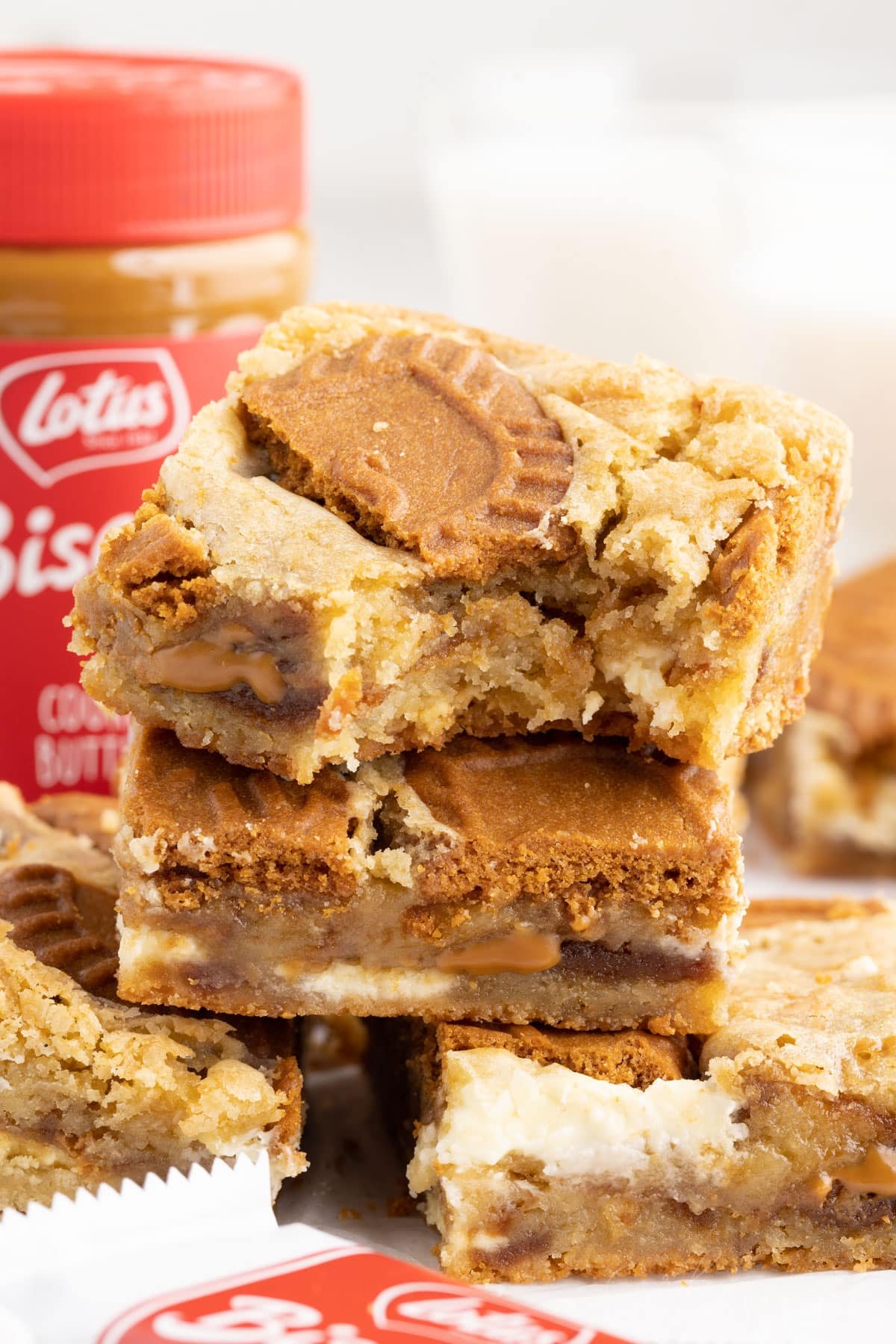 Stacked Biscoff Blondies with a bite taken from the top one.