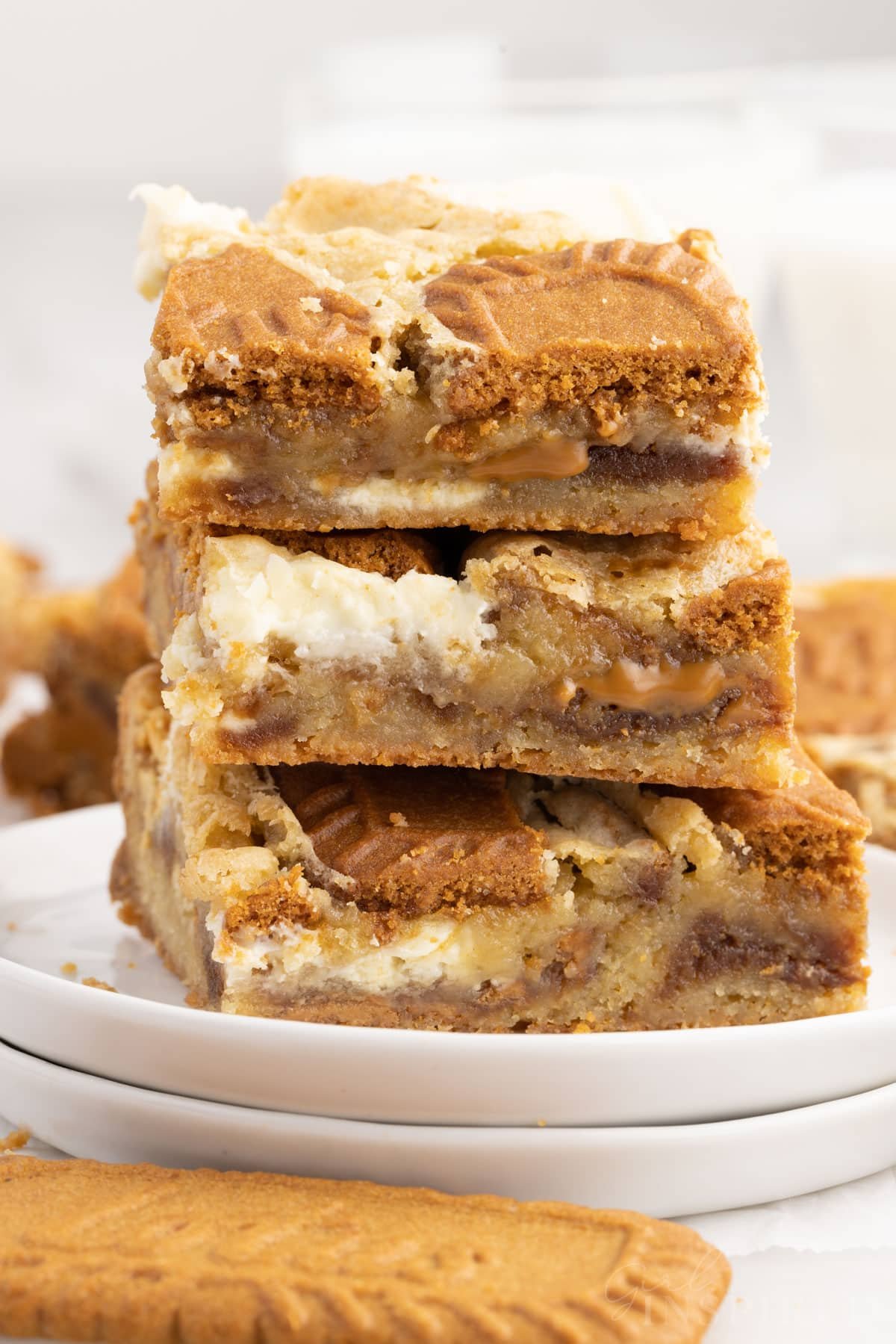 Biscoff Blondies stacked on two small dishes.