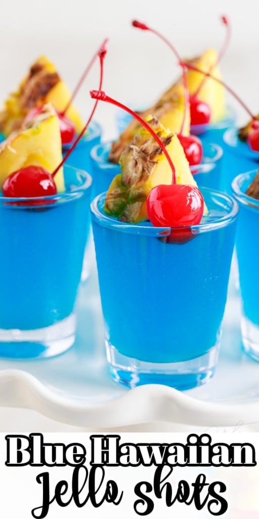 Front view of Blue Hawaiian Jello Shots with a slice of pineapple and a cherry in each.