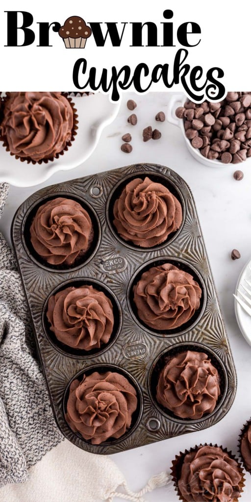Overhead shot of Brownie cupcakes in a metal cupcake pan on a marble countertop.