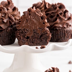 Close-up of Brownie Cupcakes on a white cake stand.