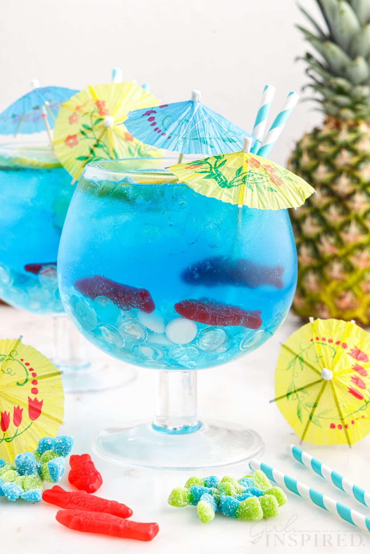 Drink umbrellas added to goblets of Fish Bowl Drinks.
