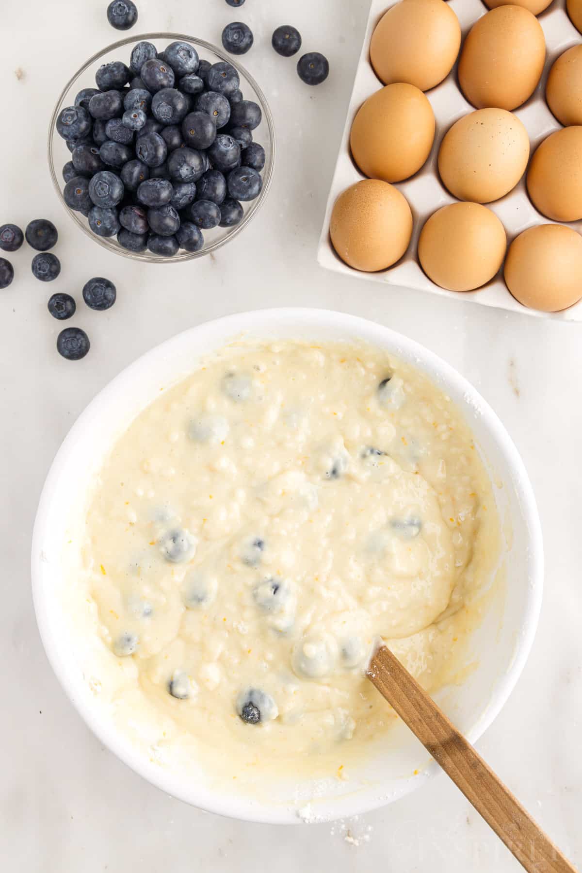Blueberries mixed into Lemon Blueberry Muffins batter.