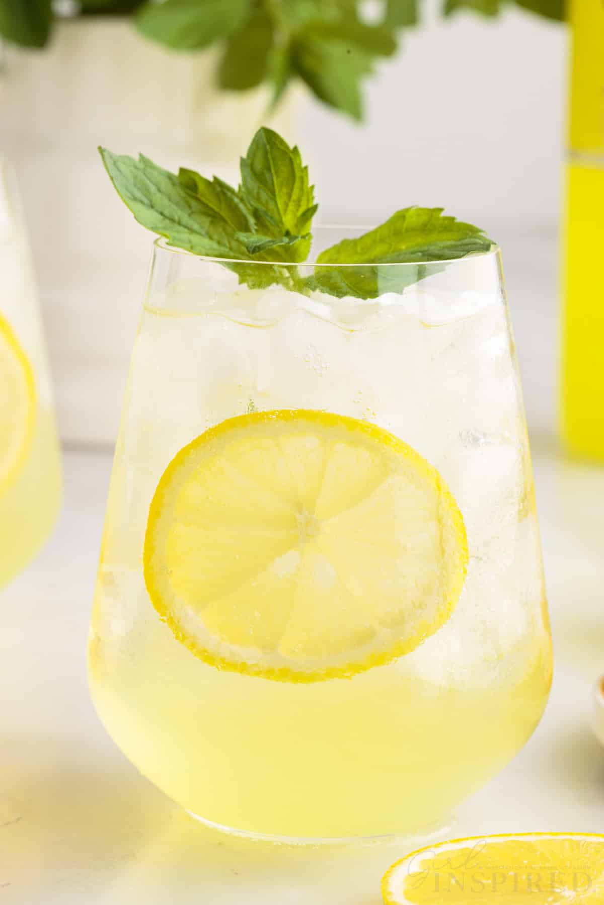 Limoncello Spritz garnished with mint and a slice of lemon.