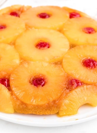 Close-up of pineapple upside down cake recipe using cake mix on a white marble countertop.